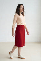 Model wearing Nuggles® 27" Relaxed Midi Skirt in Brick Red