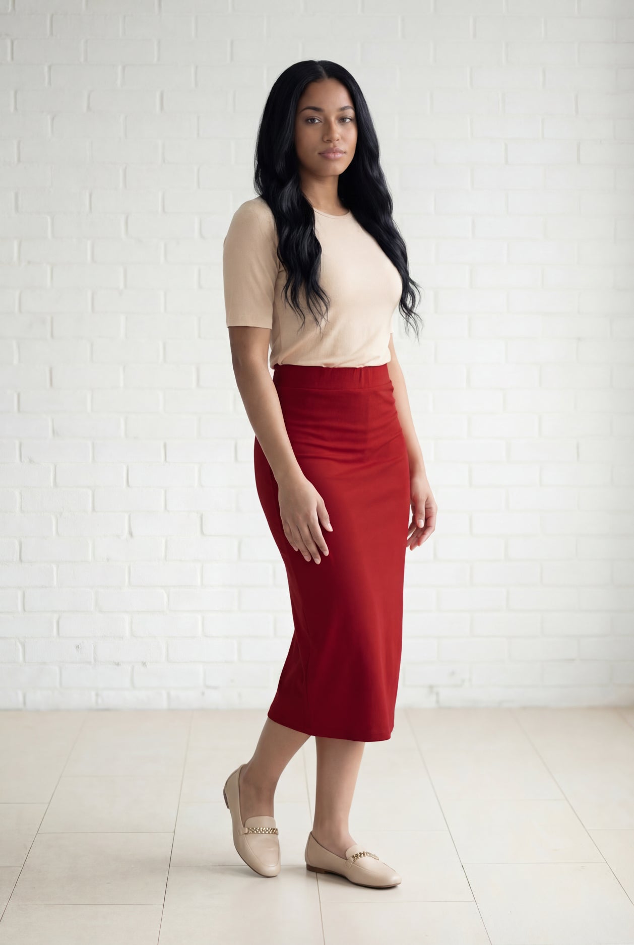 Model wearing Nuggles® 31" Relaxed Midi Skirt in Brick Red