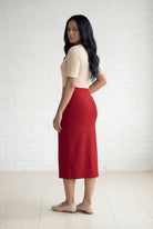 Model wearing Nuggles® 31" Relaxed Midi Skirt in Brick Red