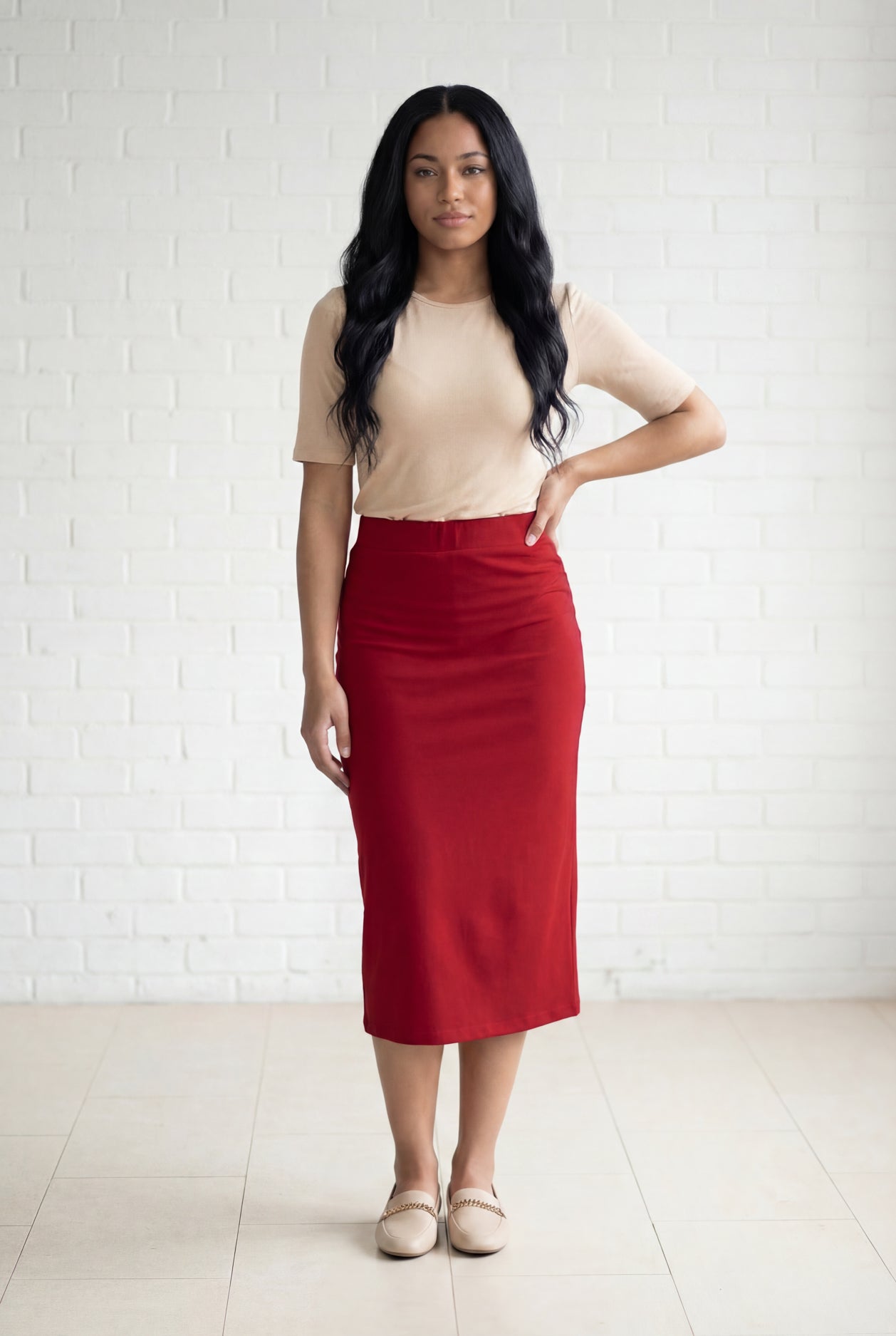 Model wearing Nuggles® 31" Relaxed Midi Skirt in Brick Red