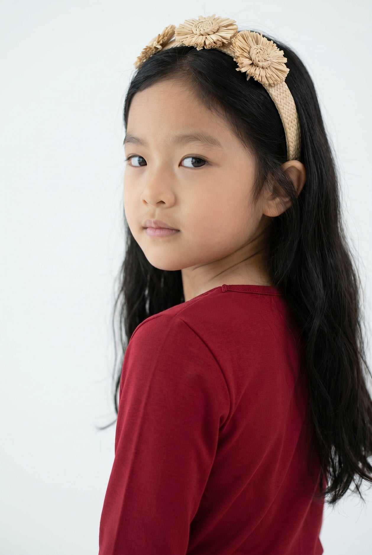 Model wearing the Girls' Nuggles® Essential 3/4 Tee in Brick Red