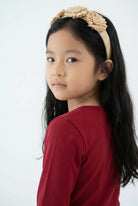Model wearing the Girls' Nuggles® Essential 3/4 Tee in Brick Red
