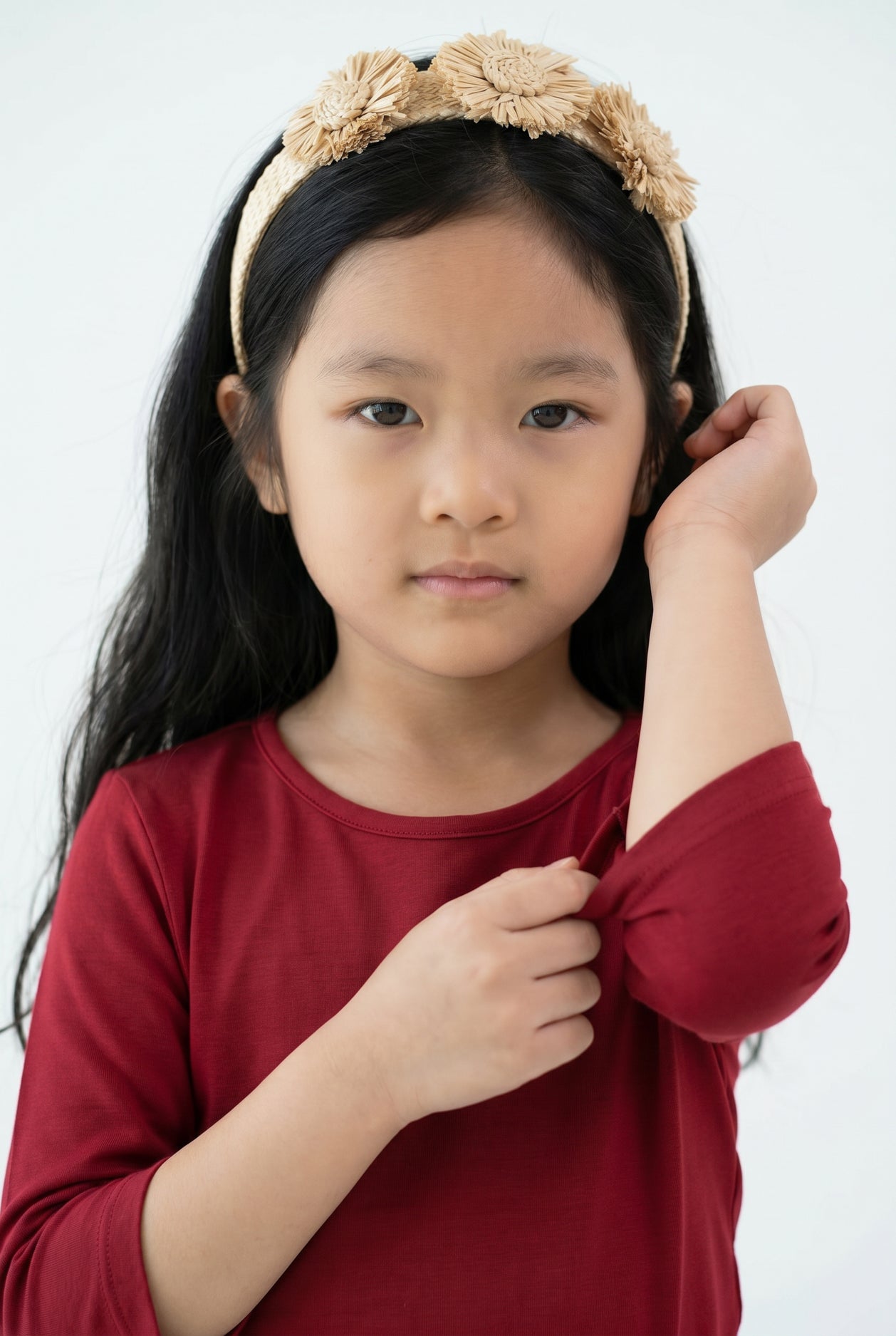 Model wearing the Girls' Nuggles® Essential 3/4 Tee in Brick Red