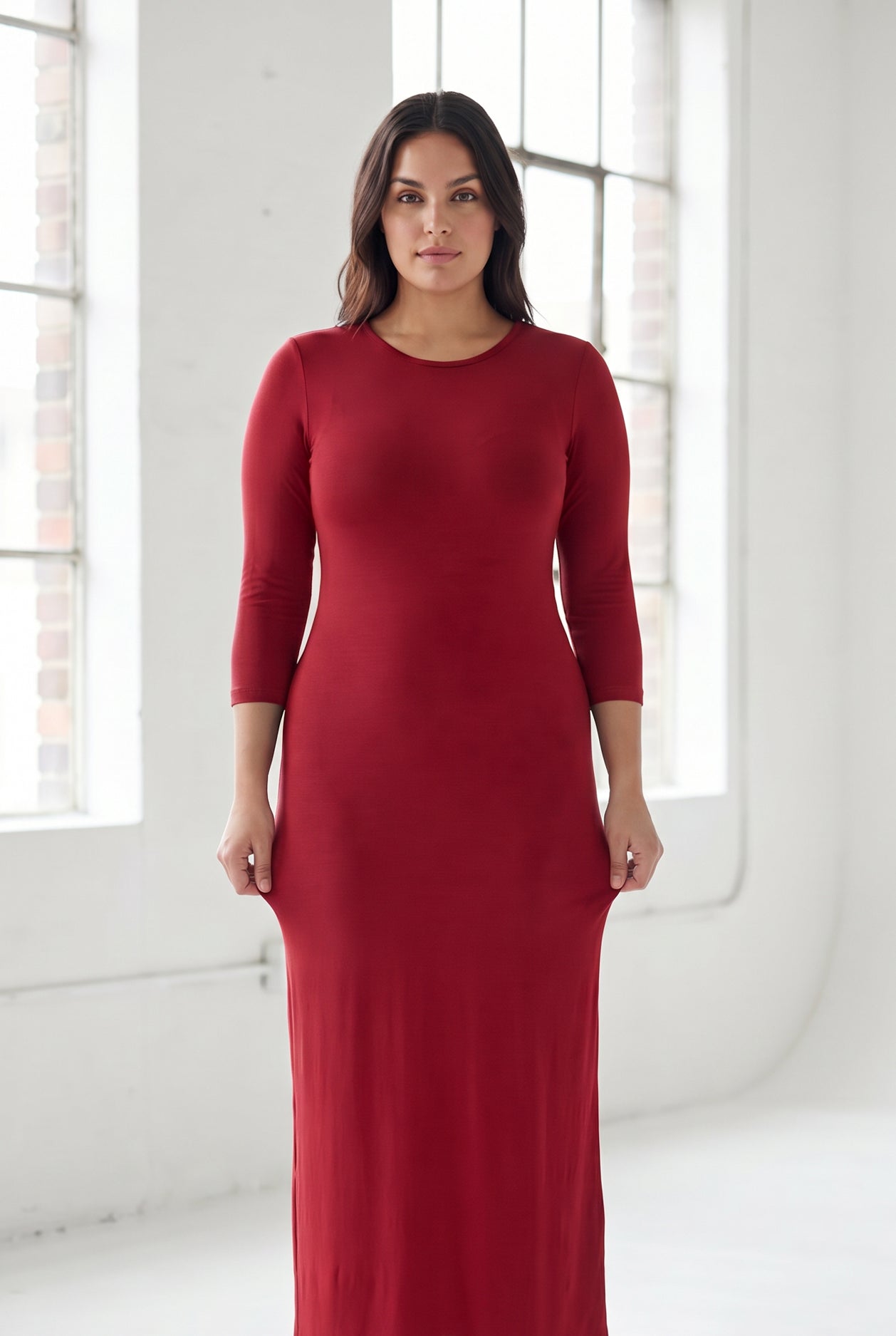 Model wearing Nuggles® Maxi Layering Dress in Brick Red