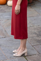 Model wearing Nuggles® Midi Layering  Dress in Brick Red