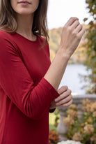 Model wearing Nuggles® Midi Layering  Dress in Brick Red
