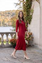 Model wearing Nuggles® Midi Layering  Dress in Brick Red