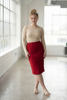 Model wearing Nuggles® 27" Classic Skirt  in Brick Red