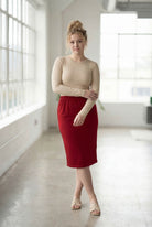 Model wearing Nuggles® 27" Classic Skirt  in Brick Red