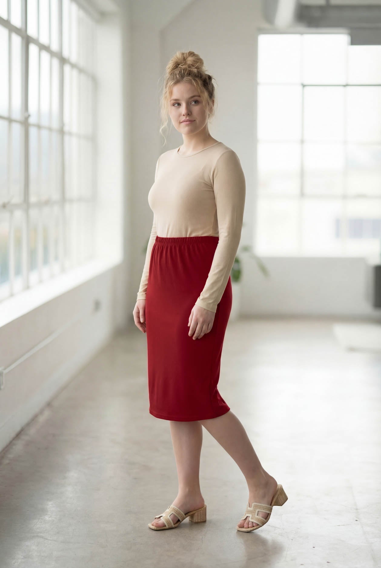 Model wearing Nuggles® 27" Classic Skirt  in Brick Red