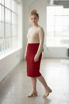 Model wearing Nuggles® 27" Classic Skirt  in Brick Red