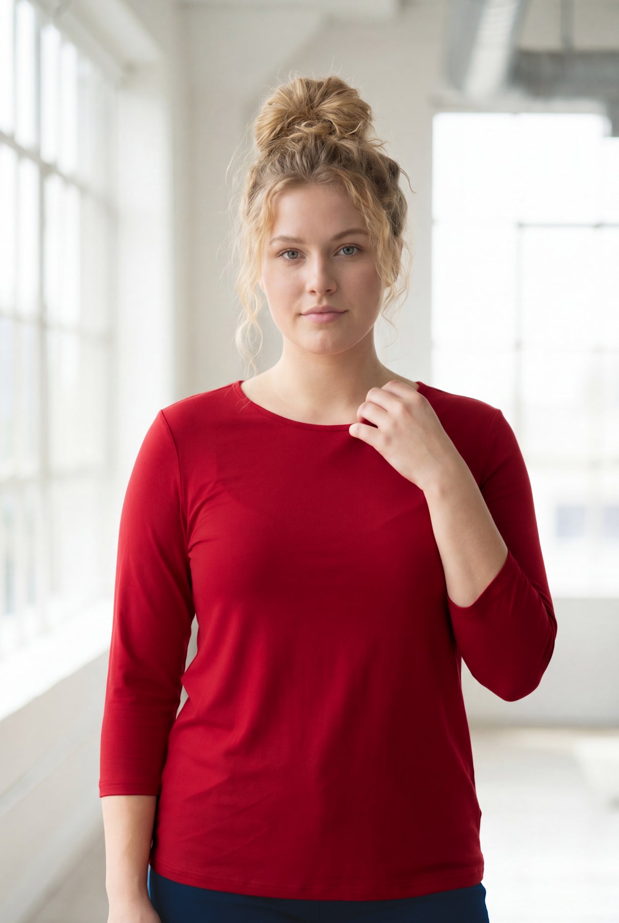 Model wearing Nuggles® 3/4 Essential Tee in Brick Red