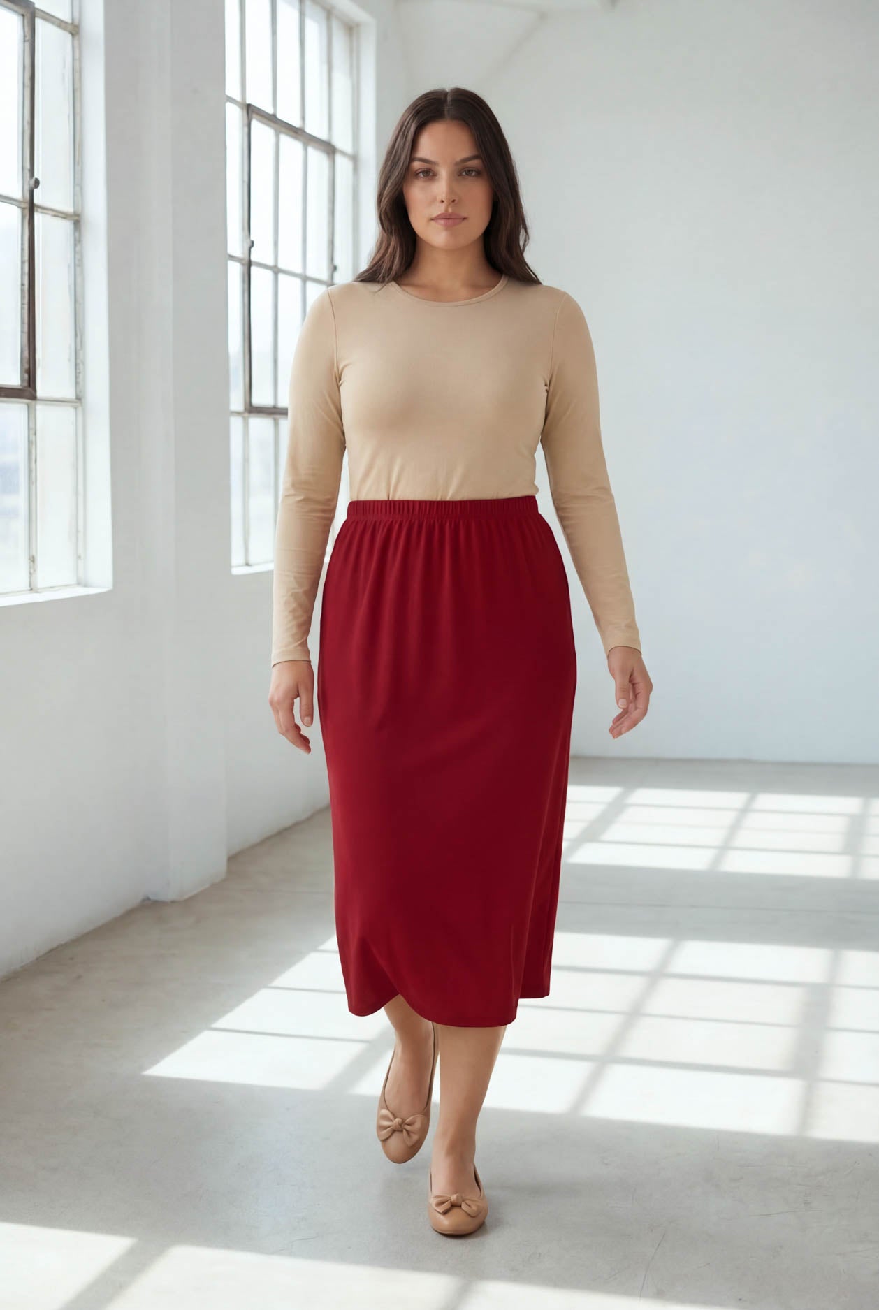 Model wearing Nuggles® 31" Classic Skirt  in Brick Red