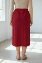 Model wearing Nuggles® 31" Classic Skirt  in Brick Red