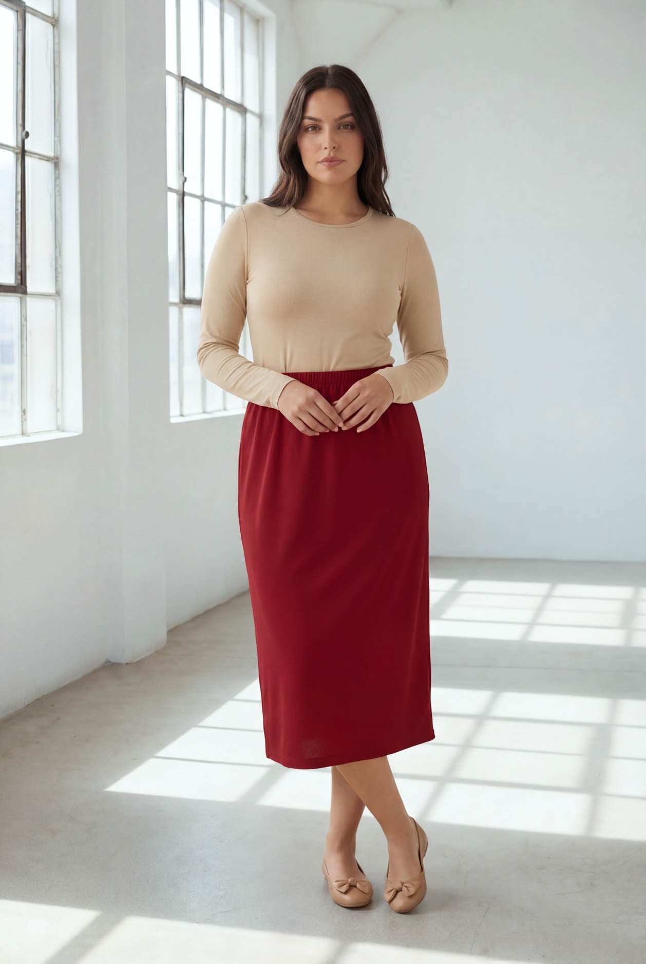 Model wearing Nuggles® 31" Classic Skirt  in Brick Red