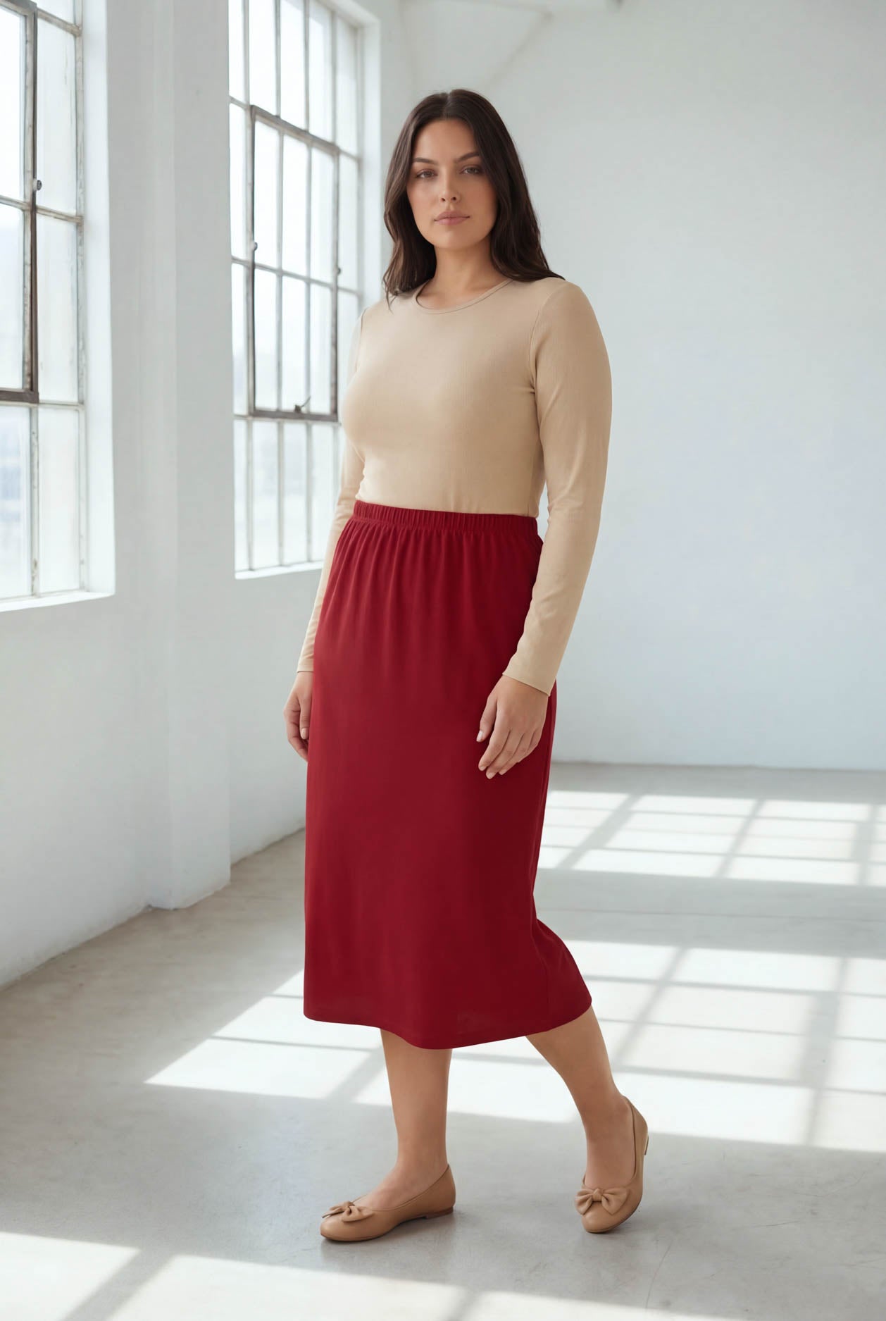 Model wearing Nuggles® 31" Classic Skirt  in Brick Red