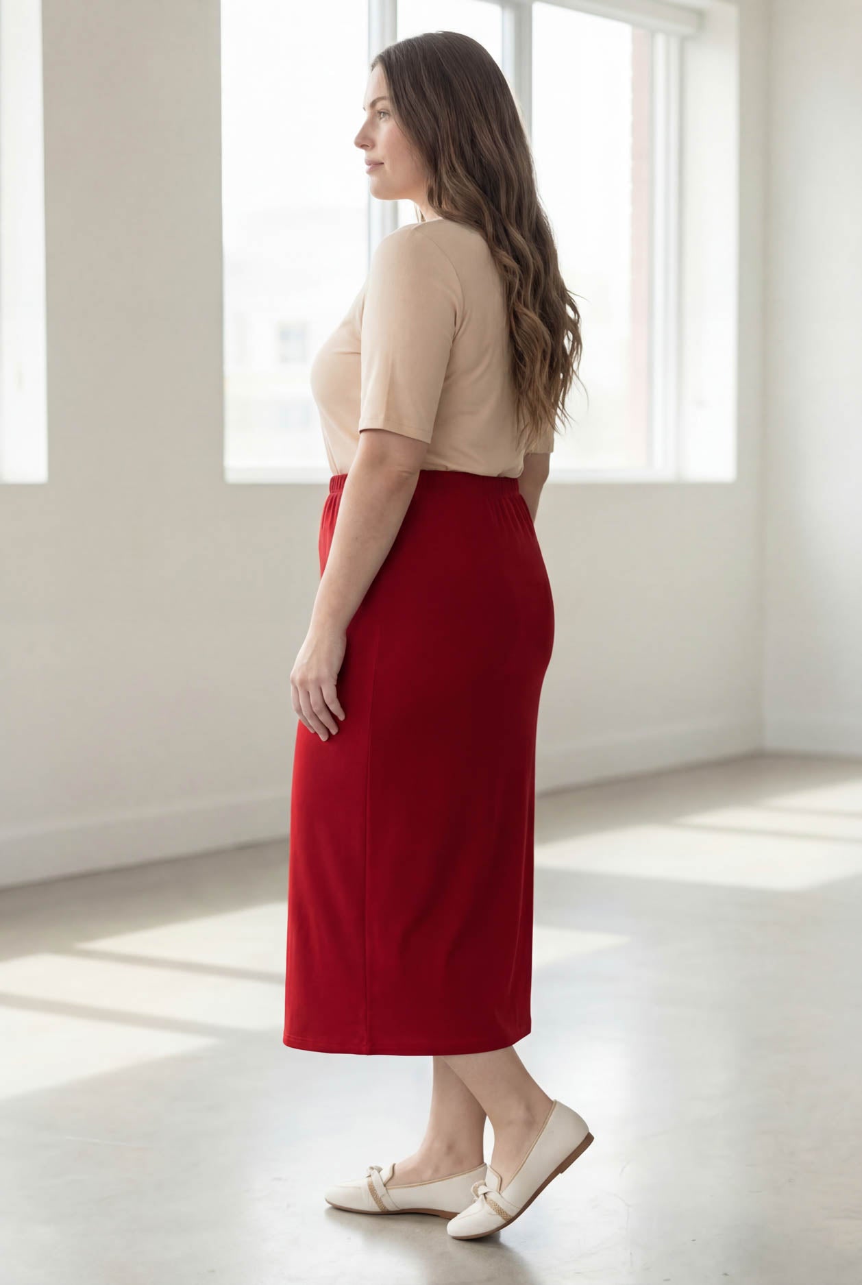 Model wearing Nuggles® 34" Classic Skirt  in Brick Red