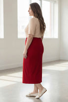 Model wearing Nuggles® 34" Classic Skirt  in Brick Red