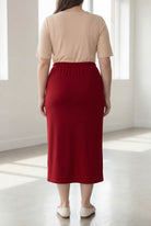 Model wearing Nuggles® 34" Classic Skirt  in Brick Red