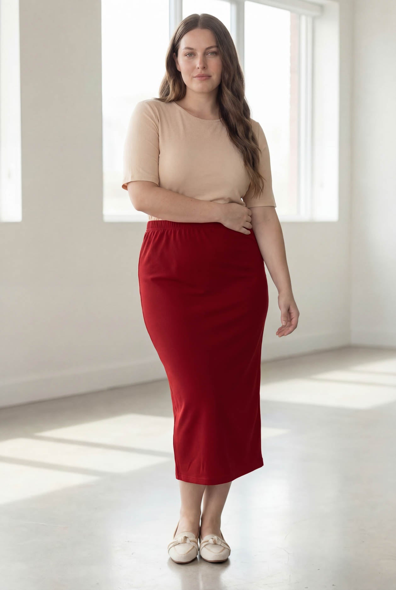Model wearing Nuggles® 34" Classic Skirt  in Brick Red