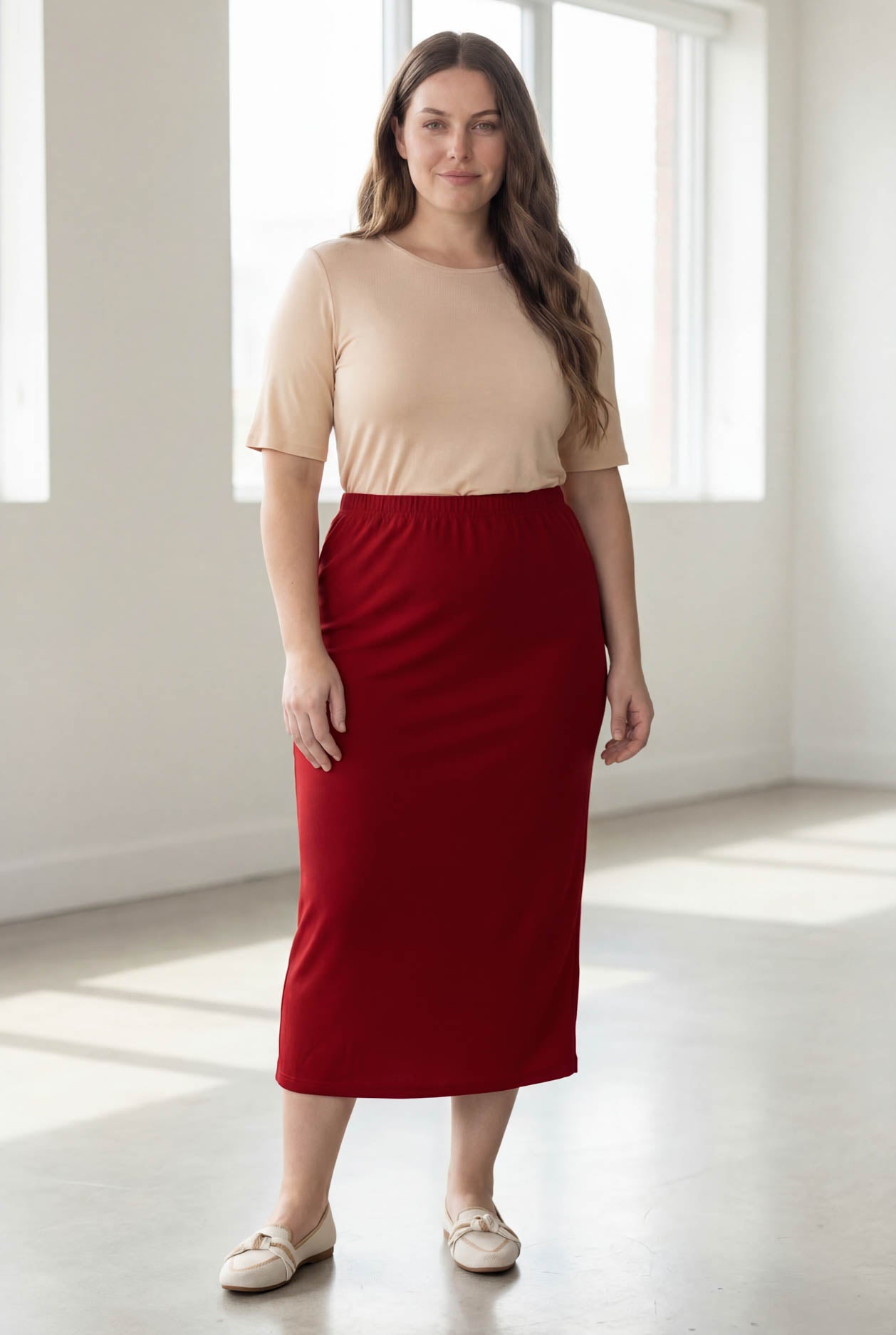 Model wearing Nuggles® 34" Classic Skirt  in Brick Red