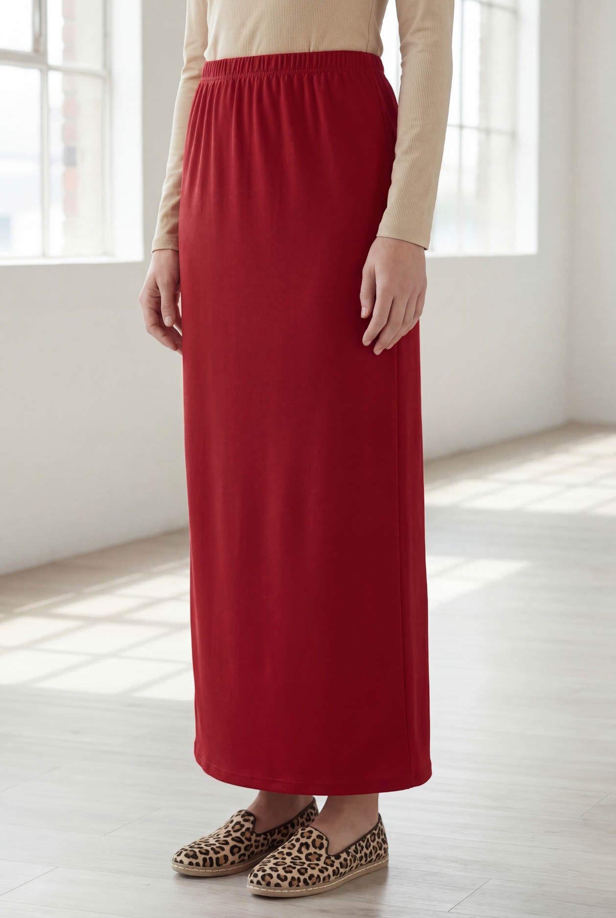 Model wearing Nuggles® 36" Classic Skirt  in Brick Red