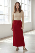 Model wearing Nuggles® 36" Classic Skirt  in Brick Red