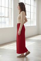 Model wearing Nuggles® 36" Classic Skirt  in Brick Red