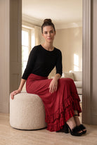 Model wearing Nuggles®  Callie Skirt in Brick Red