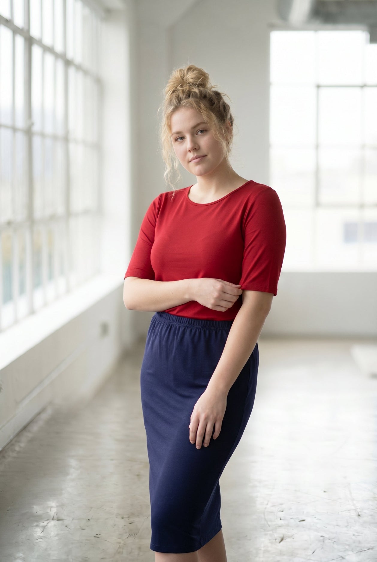 Model wearing Nuggles® Half Sleeve Essential Tee in Brick Red