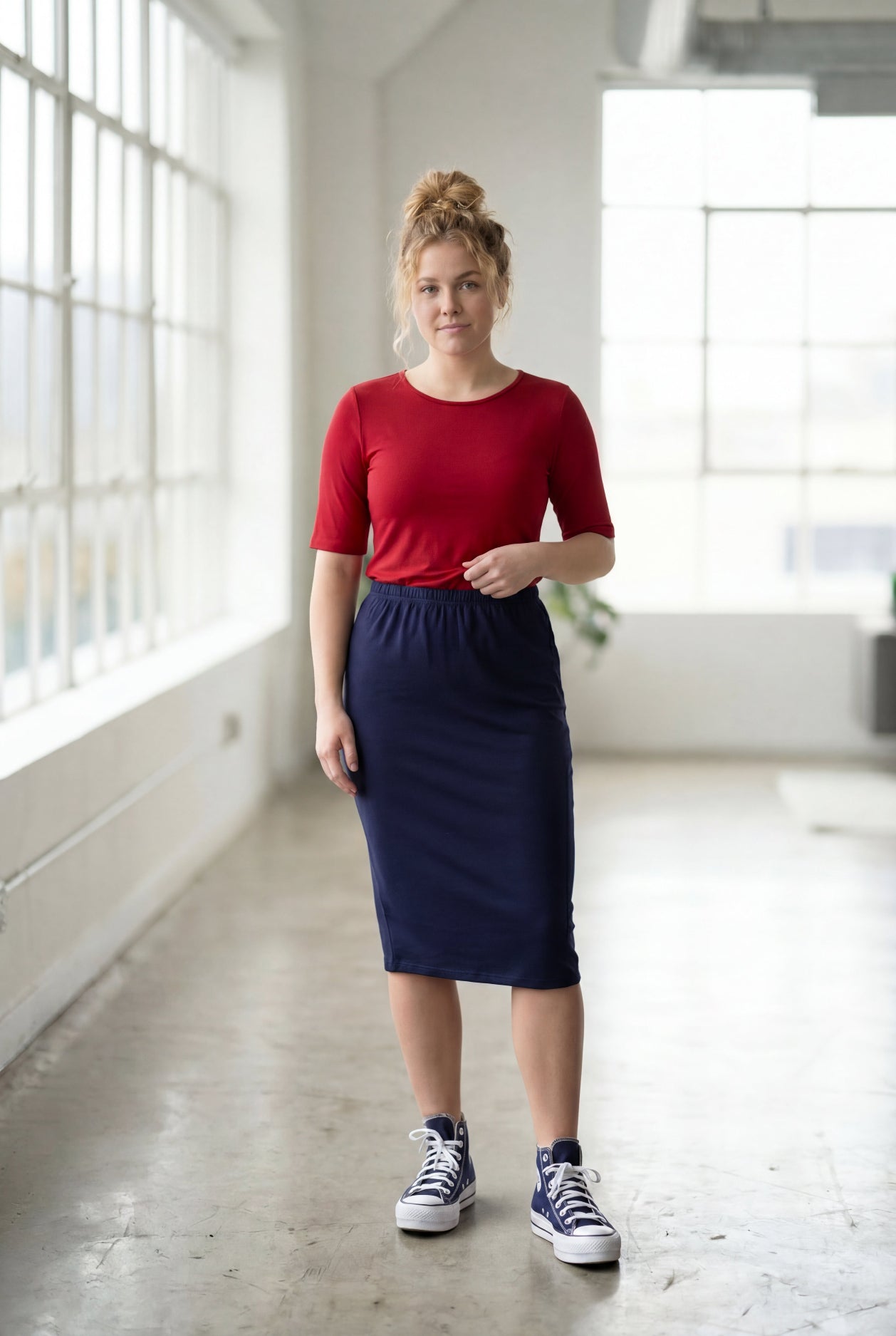 Model wearing Nuggles® Half Sleeve Essential Tee in Brick Red