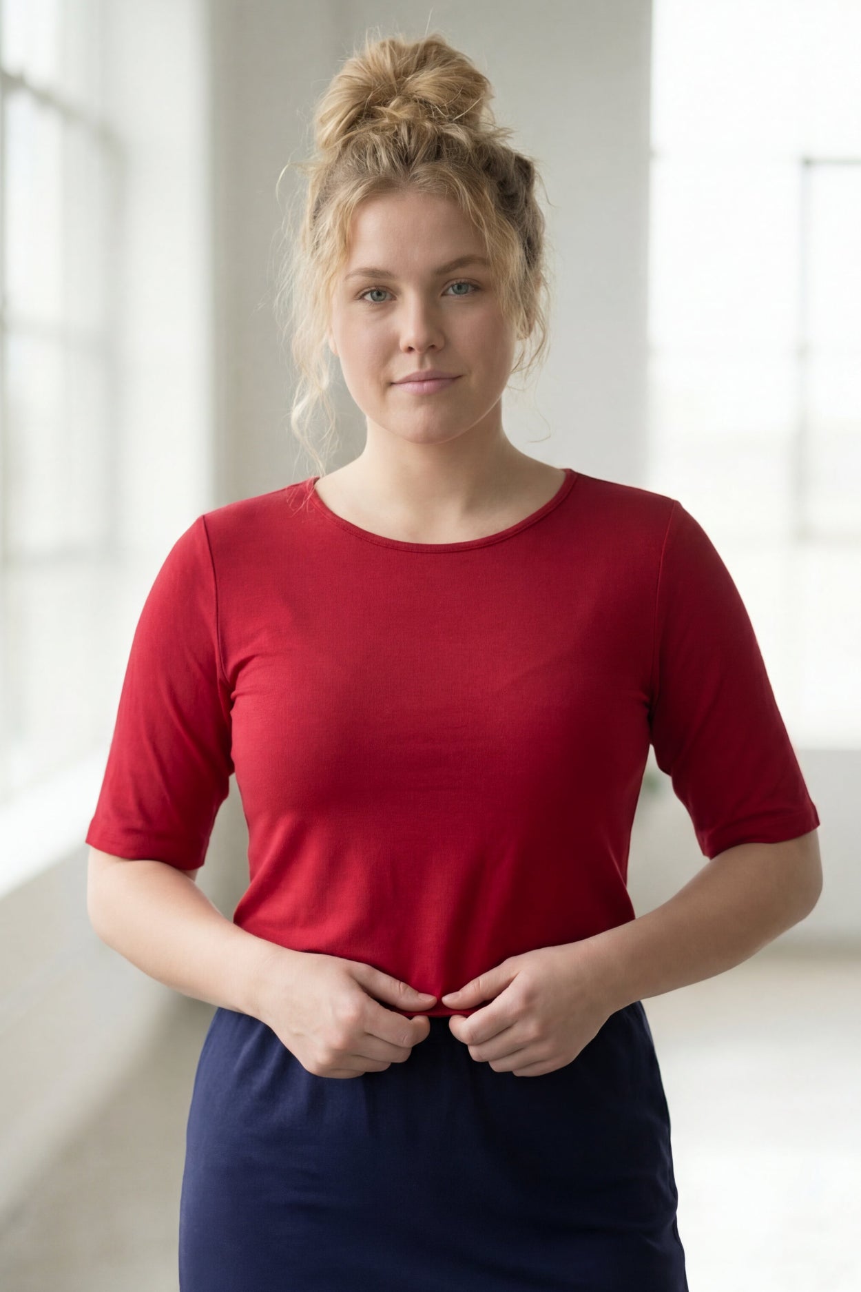 Model wearing the Nuggles® Essential Half Sleeve Tee in Brick Red