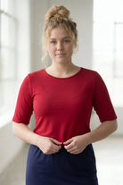 Model wearing the Nuggles® Essential Half Sleeve Tee in Brick Red