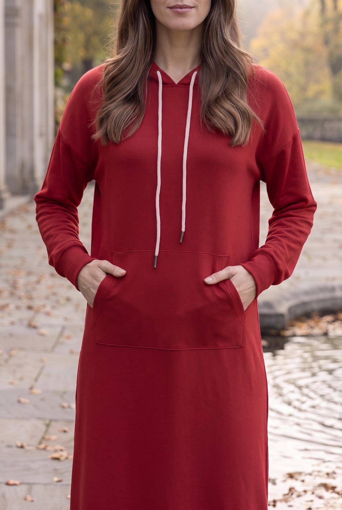 Model wearing Nuggles®   Hoodie Dress in Brick Red