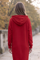 Model wearing Nuggles®   Hoodie Dress in Brick Red