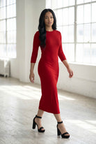 Model wearing Nuggles® Ribbed Layering Dress in Brick Red