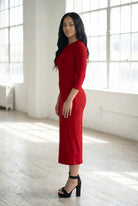 Model wearing Nuggles® Ribbed Layering Dress in Brick Red