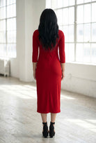 Model wearing Nuggles® Ribbed Layering Dress in Brick Red