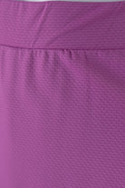 Model wearing Nuggles® 27" All-Sport Skirt in Bubble Gum