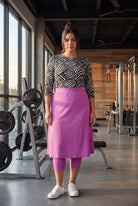 Model wearing Nuggles® 27" All-Sport Skirt in Bubble Gum