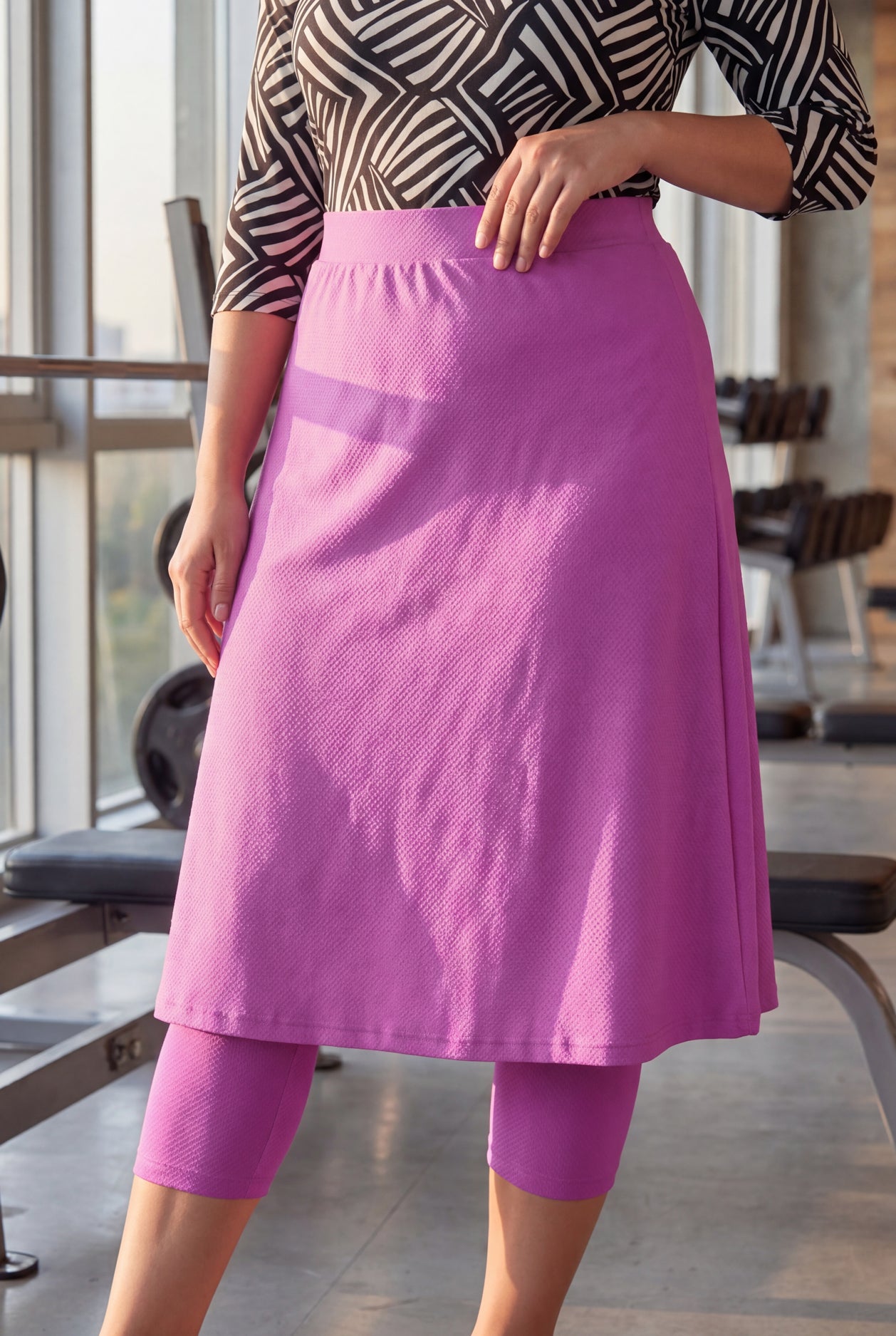 Model wearing Nuggles® 27" All-Sport Skirt in Bubble Gum
