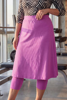 Model wearing Nuggles® 27" All-Sport Skirt in Bubble Gum