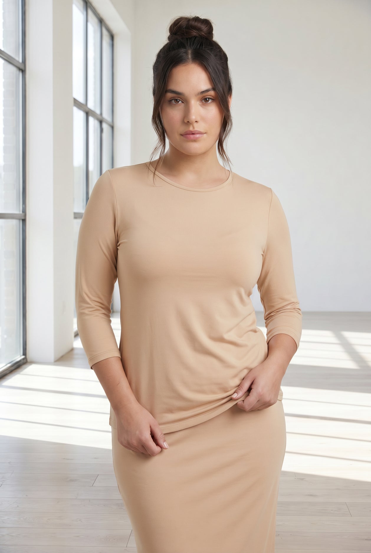 Model wearing Nuggles® 3/4 Essential Tee in Buff