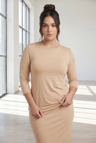 Model wearing Nuggles® 3/4 Essential Tee in Buff