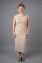 Model wearing Nuggles® Wide Neck Tank in Buff