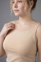 Model wearing Nuggles® Wide Neck Tank in Buff