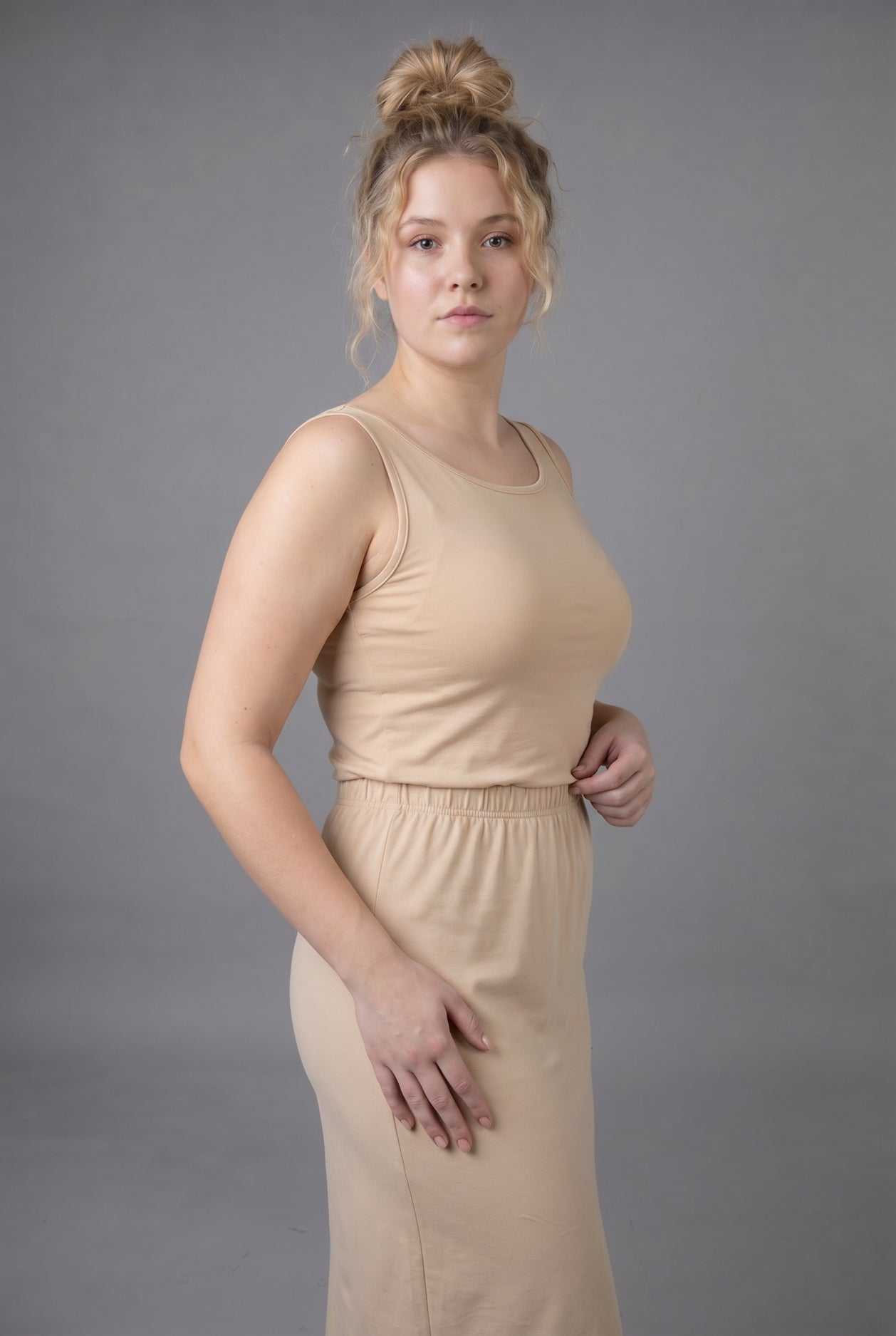 Model wearing Nuggles® Wide Neck Tank in Buff