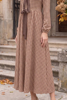 Model wearing Nuggles®  Addison Dress in Buffalo Check