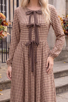 Model wearing Nuggles®  Addison Dress in Buffalo Check