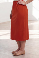 Model wearing Nuggles® 31" Classic Skirt in Burnt Orange